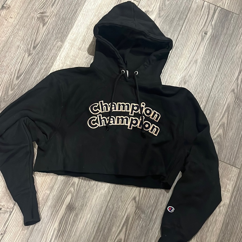 Champion embroidered crop top black hoodie with blue, white & orange letters